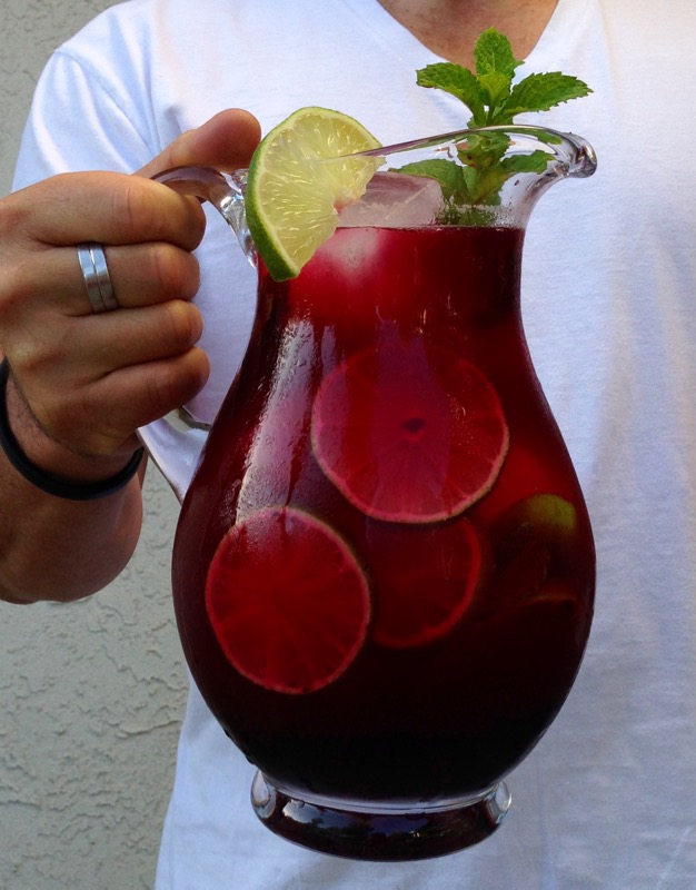 Man Holding a Pitcher of Blueberry Limeade