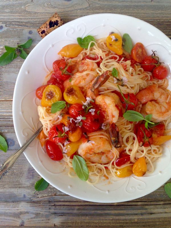 Shrimp Capellini Pomodoro with Lemon and Basil on a Rustic Table