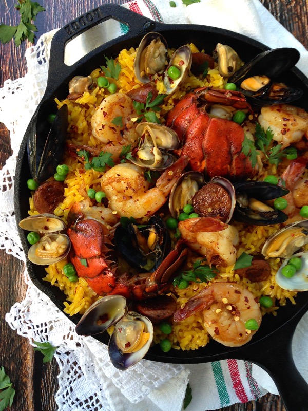 Seafood Spanish Paella in a Cast Iron Pan with Lobster and Shrimp
