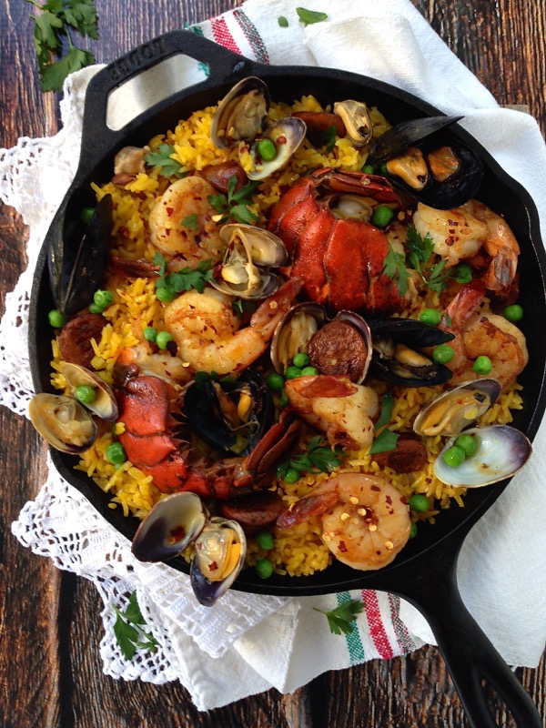 Lobster, Shrimp and Clams Paella in a Cast Iron Pan
