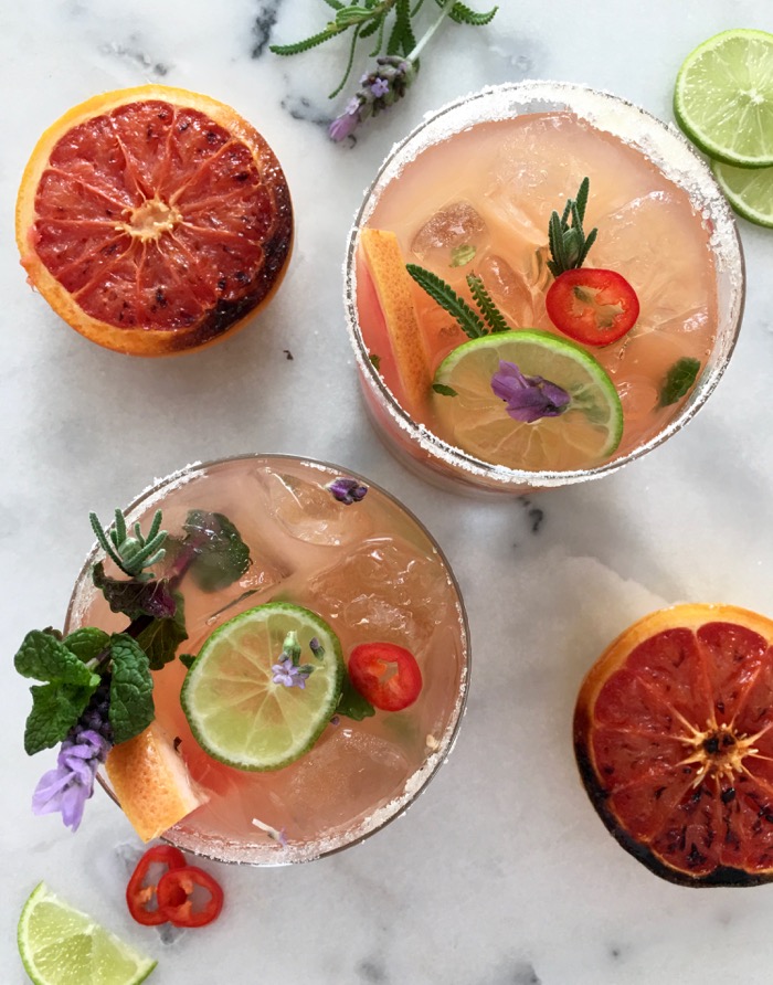 Glasses of Grapefruit Mojito with Red Chili, Lime and Lavender Flowers
