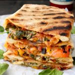 Calzone Filled with Veggies on a Rustic Table