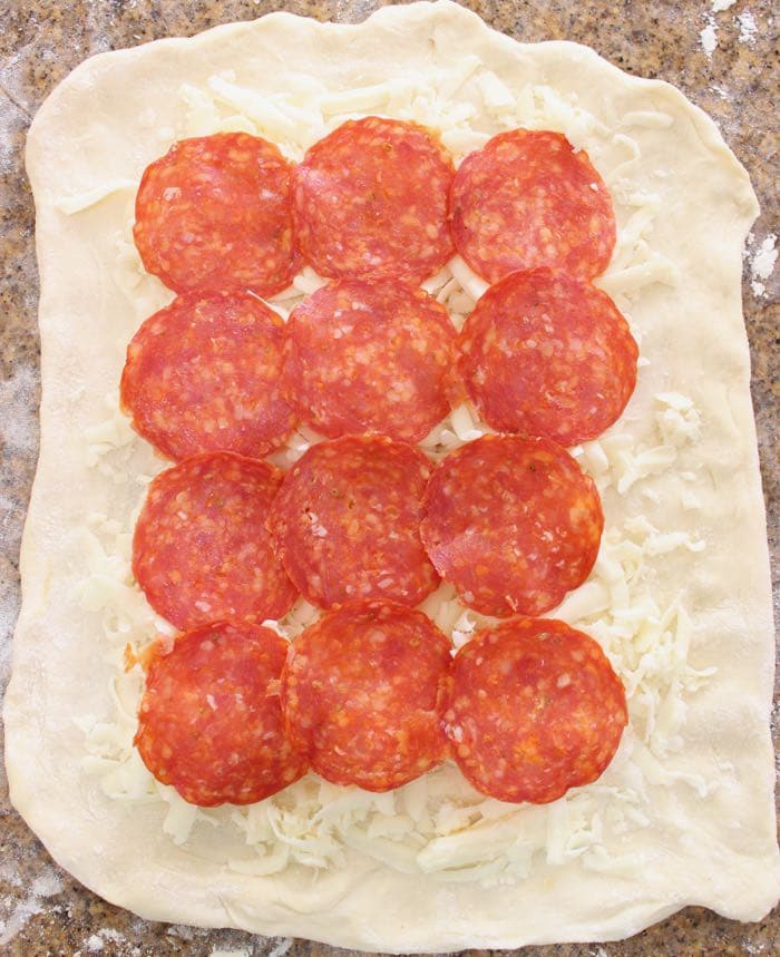 Stromboli dough layered with pepperoni and cheese