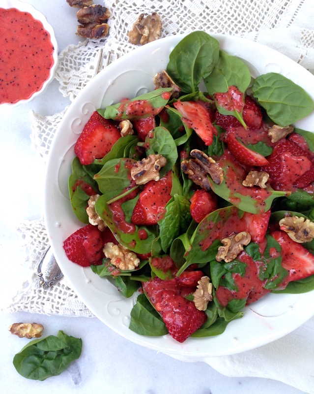 White Bowl of Strawberry Spinach Salad with Walnuts on a Crochet Kitchen Towel
