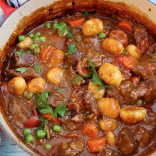 Red Pot Of Beef Stew with Gnocchi Dumplings