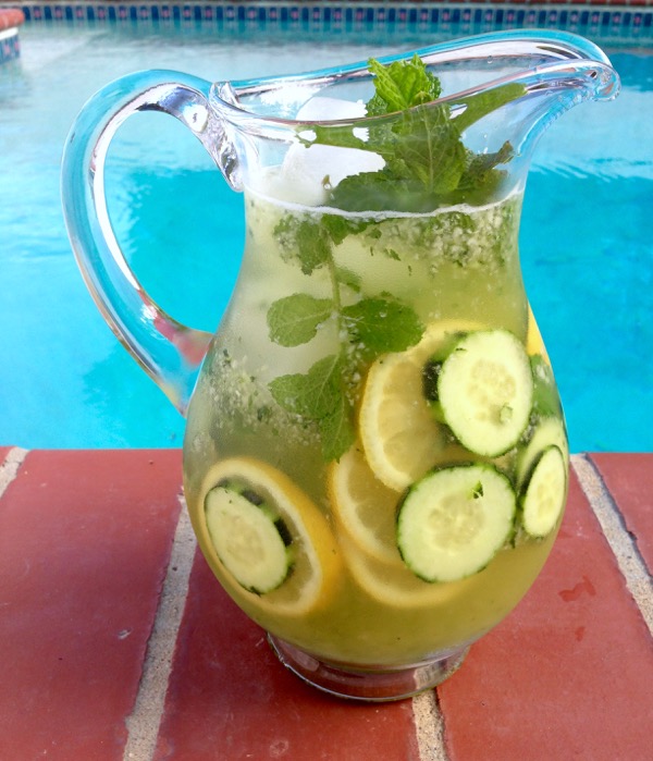 Pitcher of Cucumber Lemonade over Ice with Mint and Honey, Sliced Cucumber and Lemons