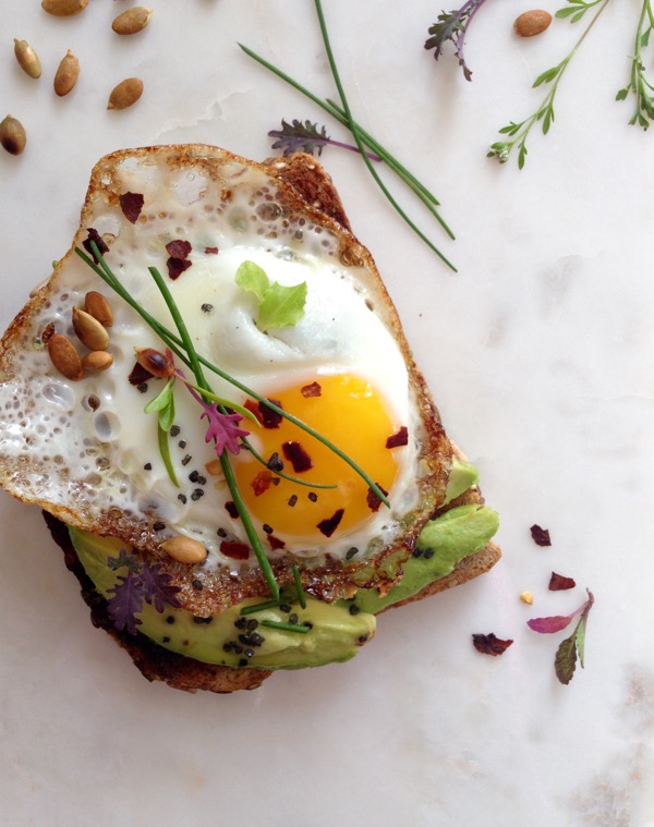 Avocado Toast Breakfast with Egg, Herbs and Red Pepper Flakes