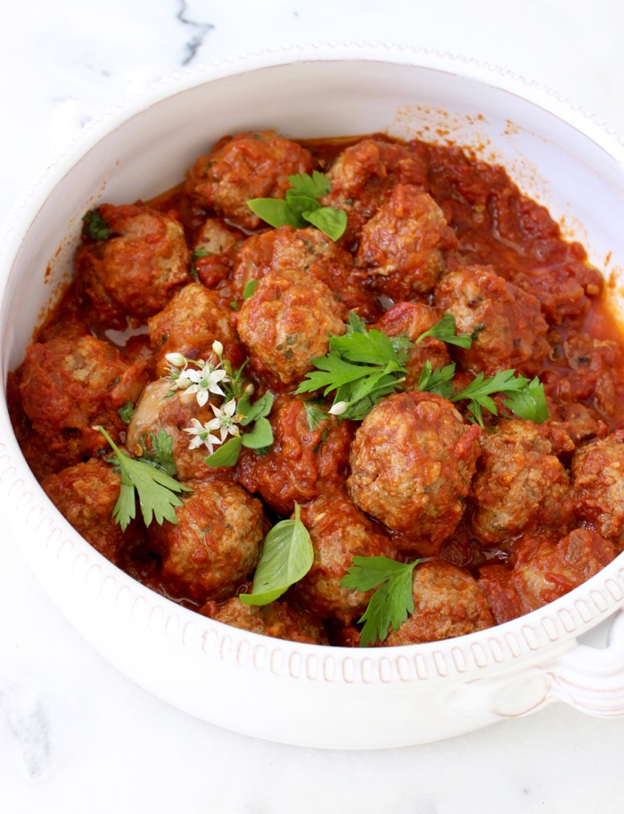 Ricotta Meatballs in Red Sauce in a White Ceramic Bowl