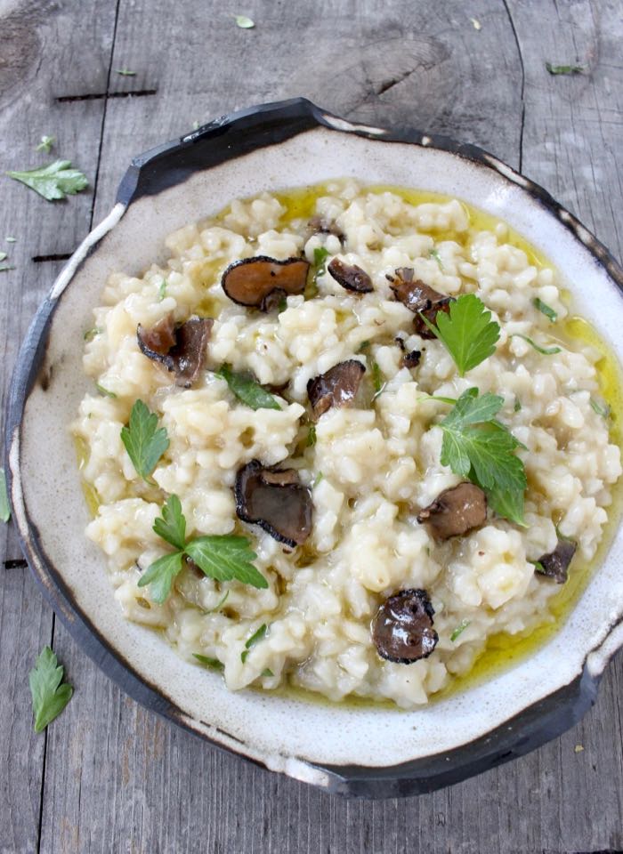 Bowl of Truffle Risotto with White Wine and Black Truffles