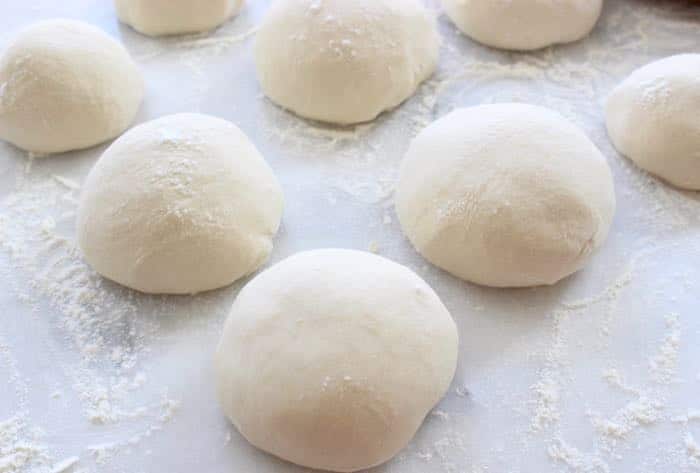 Pizza Dough Balls on a Marble Board ready for Freezing