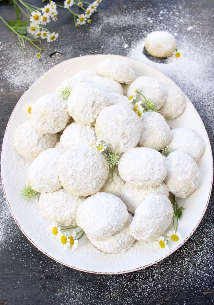 White Serving Tray of Italian Wedding Cookies Coated in Powdered Sugar