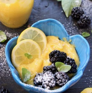 Blue Bowl of Lemon Curd with Blackberries, Basil and Powdered Sugar