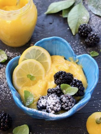 Blue Bowl of Lemon Curd with Blackberries, Basil and Powdered Sugar