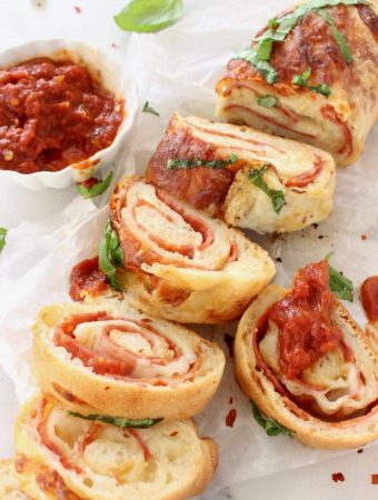 Slices of stromboli filled with melting cheese and cold cuts