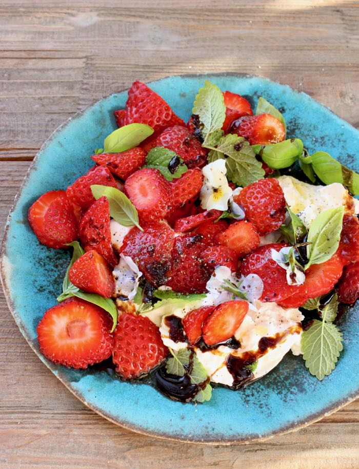 Rustic Blue Plate of Burrata Strawberry Balsamic Salad Drizzled with Homemade Balsamic Glaze