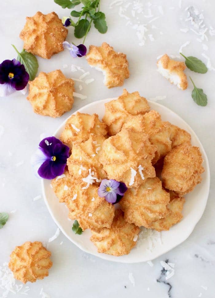 Photo of Coconut Macaroons Garnished with Shredded Coconut and Violas